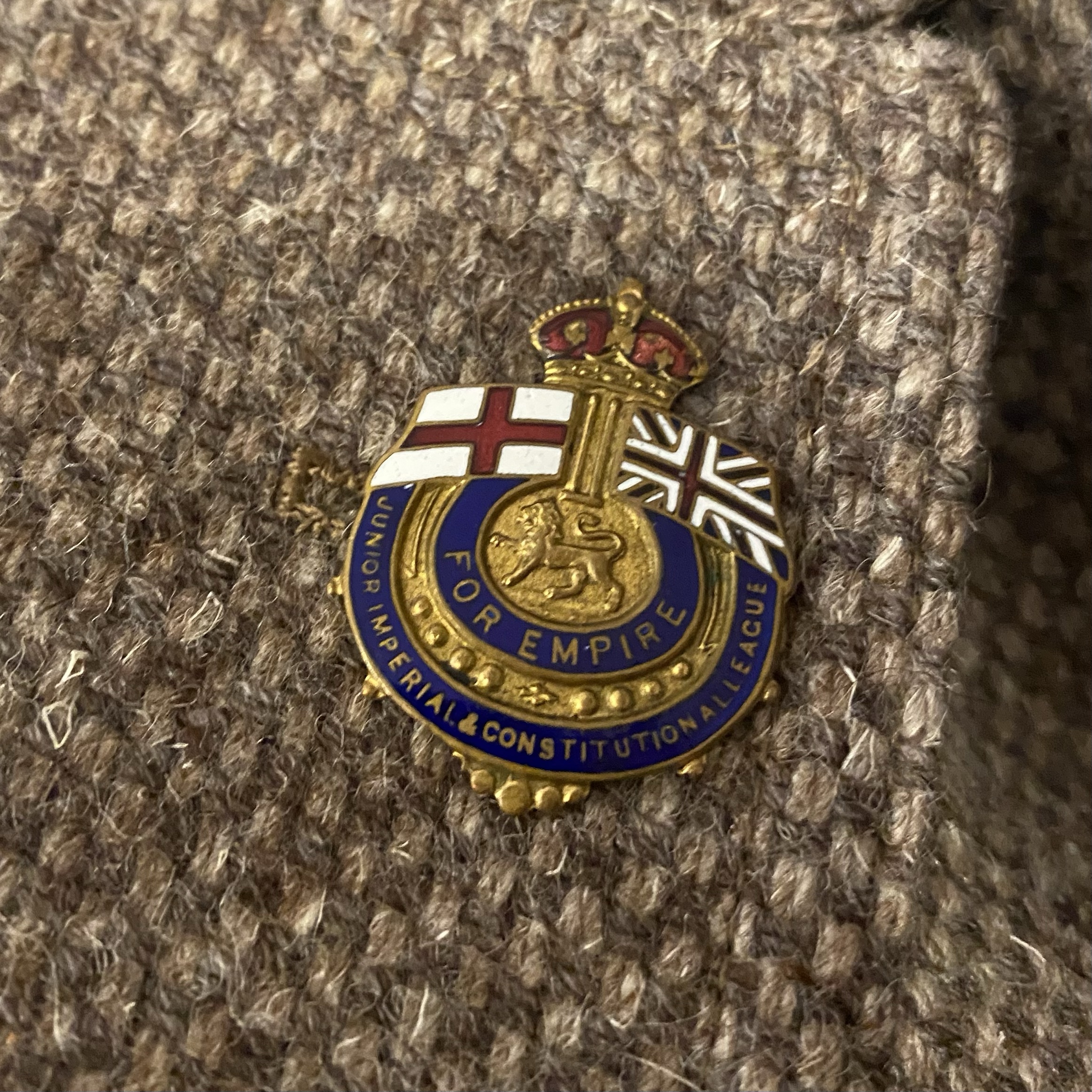 Enamel badge with a crown, featuring the text 'FOR EMPIRE' and symbols of the Union Jack and St George's Cross.
