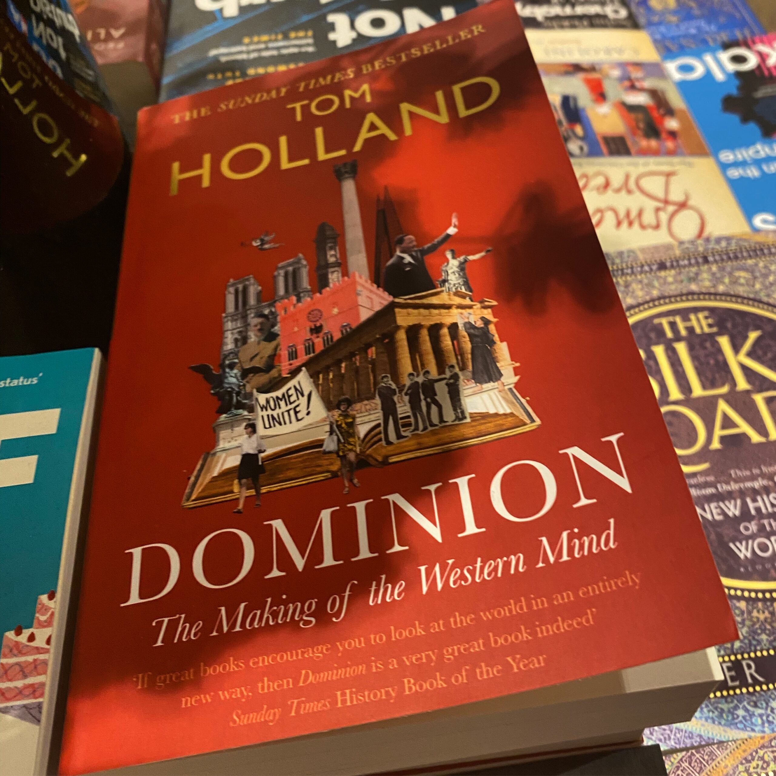 Book cover of 'Dominion: The Making of the Western Mind' by Tom Holland featuring a historical illustration.