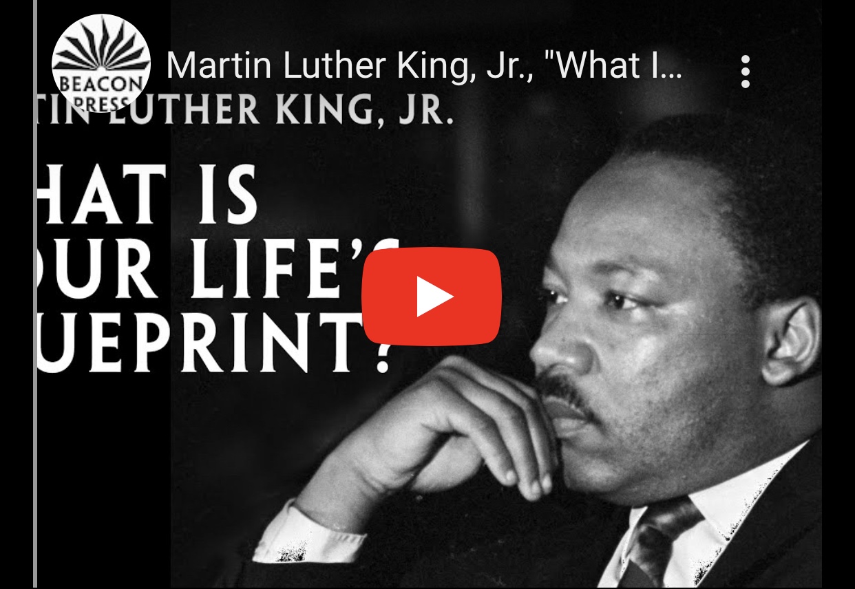 Martin Luther King Jr. delivering a speech with a focused expression, emphasising the importance of life's purpose.
