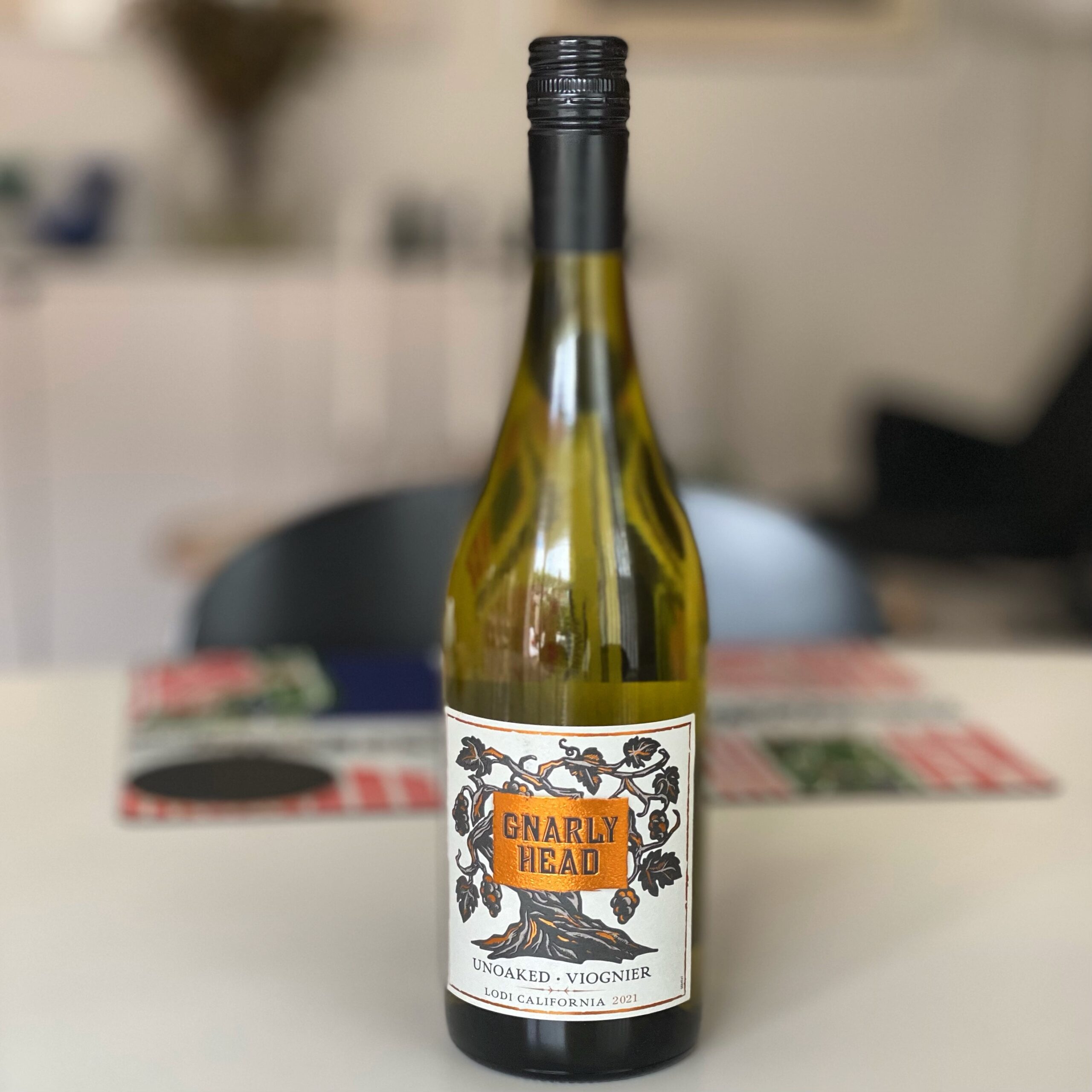 Gnarly Head Un-Oaked Viognier wine bottle with a decorative label featuring vines and the brand name.