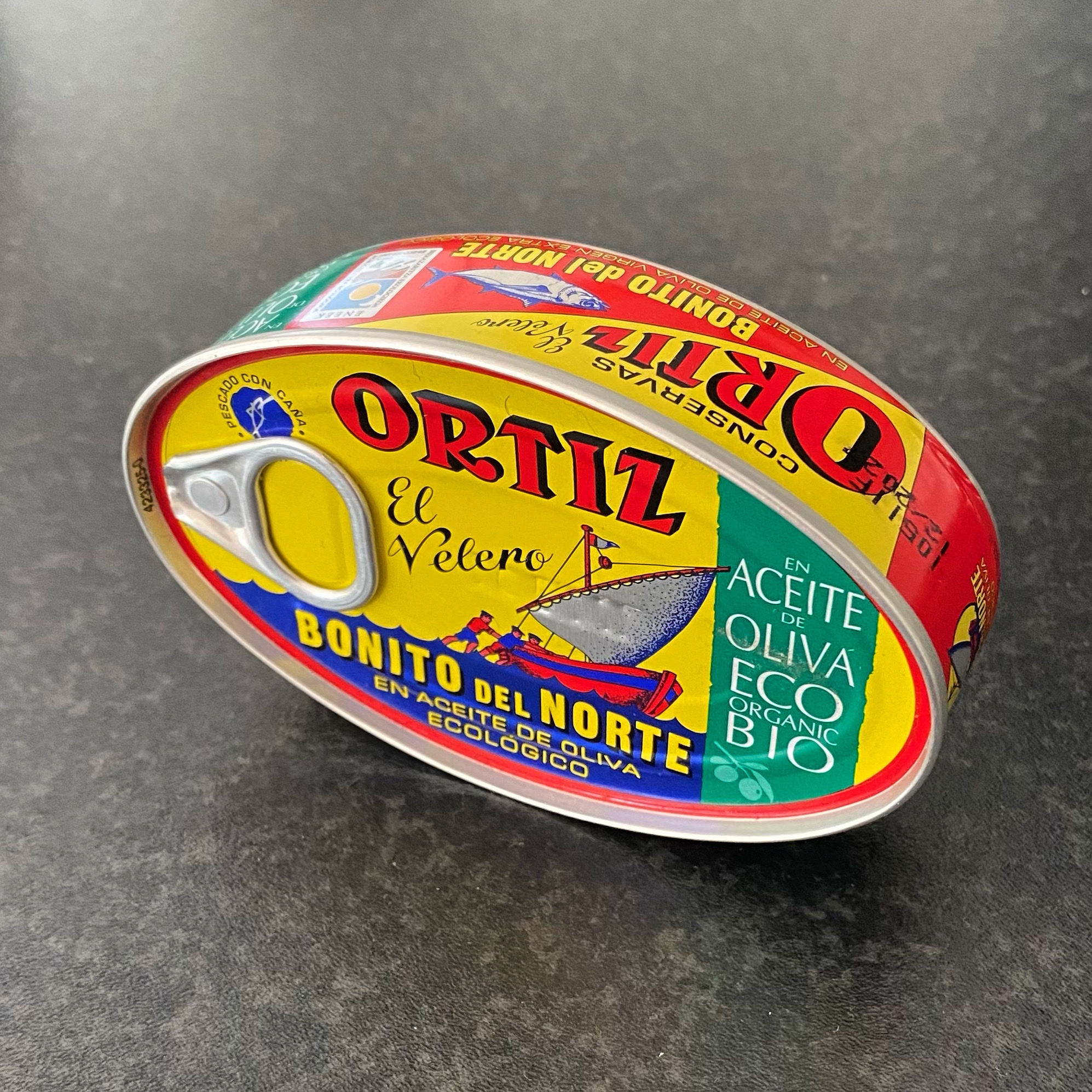 Can of Conservas Ortiz Bonito del Norte tuna in olive oil with a pull tab lid and colourful packaging.