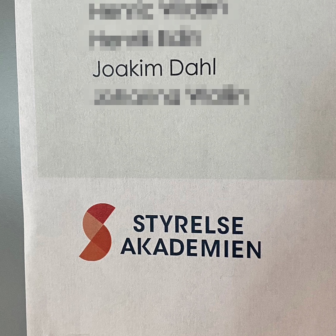 Document featuring the name Joakim Dahl and the logo of Styrelse Akademien.