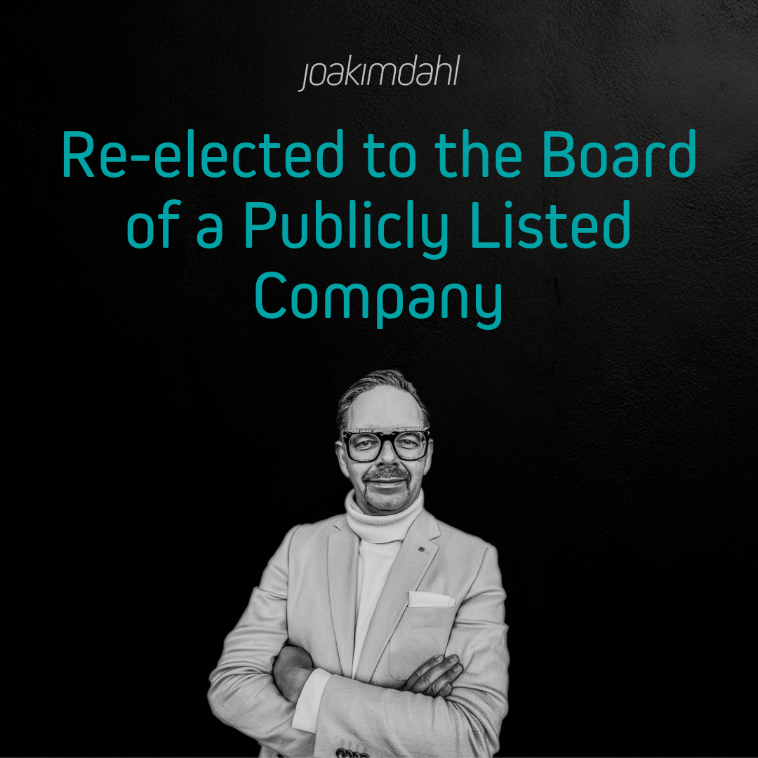 A man in a white turtleneck and glasses standing against a dark background with text about re-election to a board.