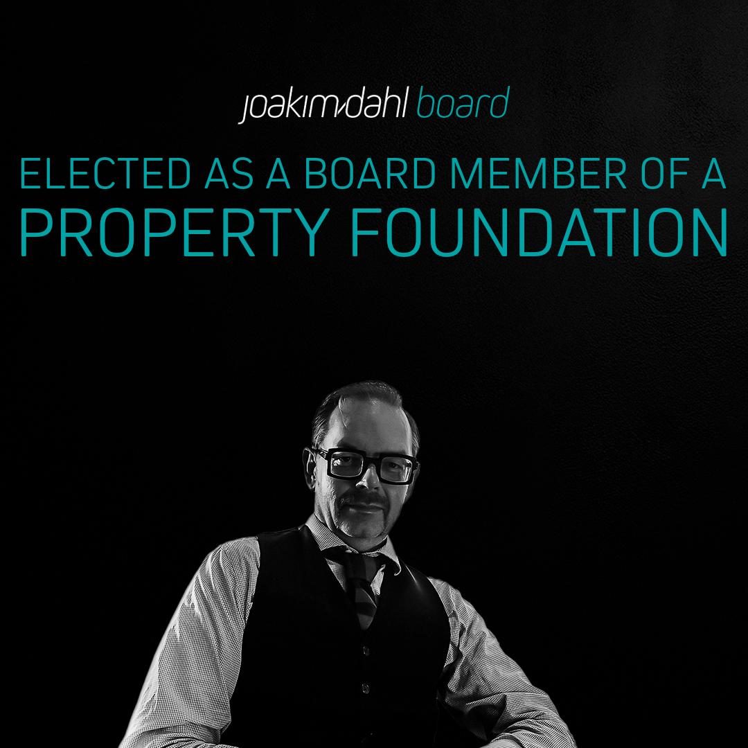 Joakim Dahl, a board member of a property foundation, seated with a serious expression in formal attire.