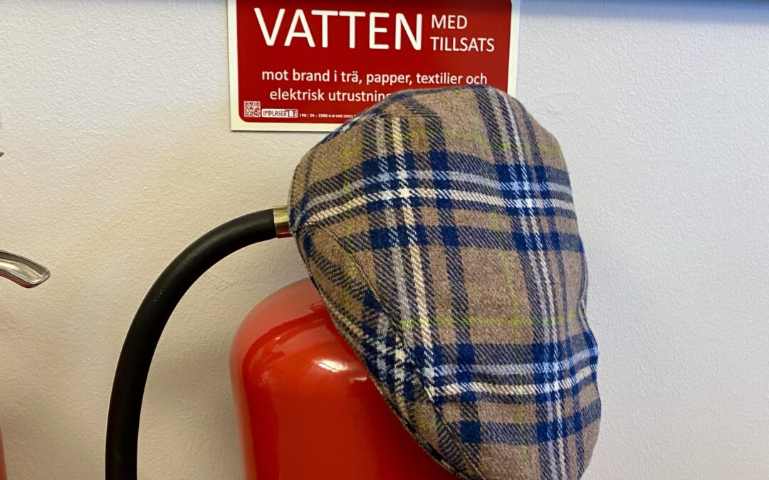 My flat cap at the board meeting