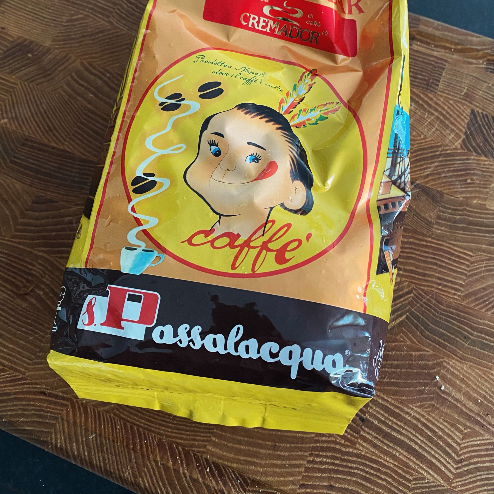 Passalacqua coffee blend from Naples, Italy in a yellow and red bag, with CREMADOR branding visible on the packaging.