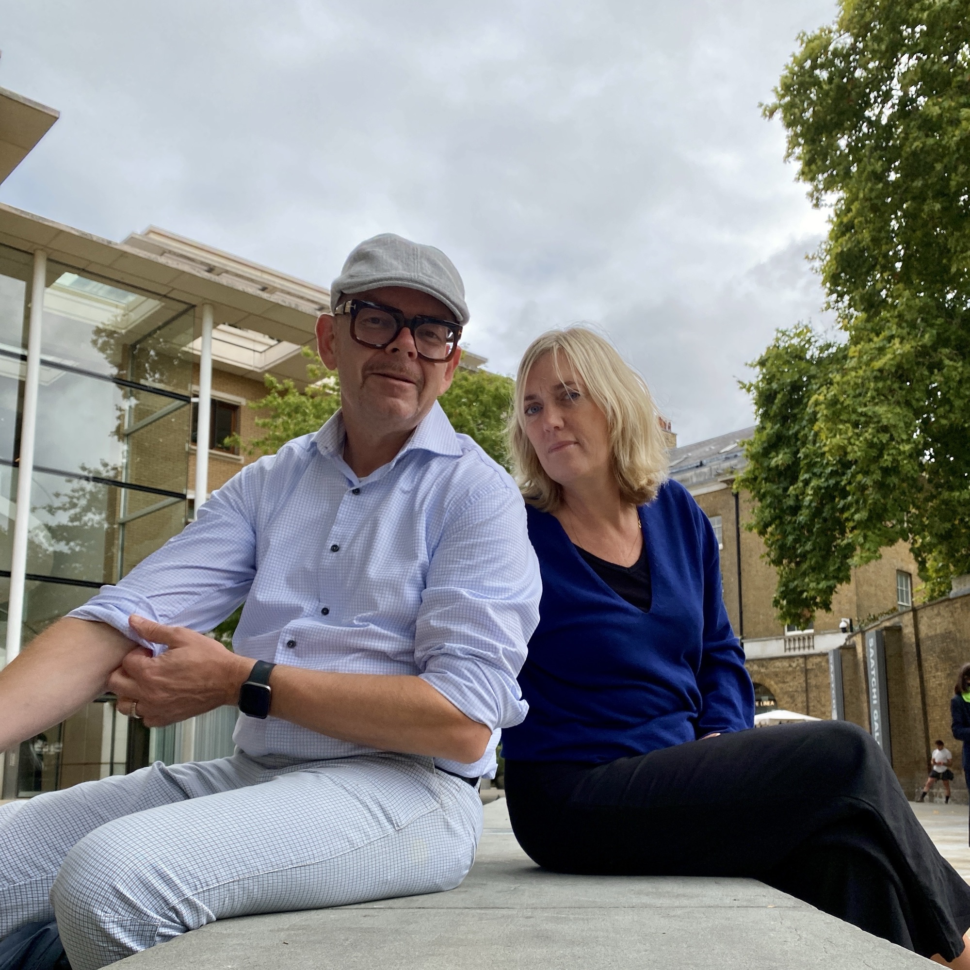 Two people sit together outside on King’s Road in Chelsea, reflecting on London’s punk history and changing neighbourhood.
